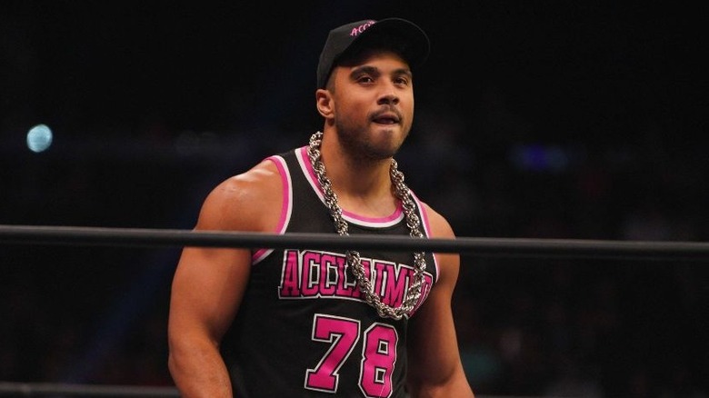 Former AEW star Max Caster looks out towards the crowd while standing in the ring