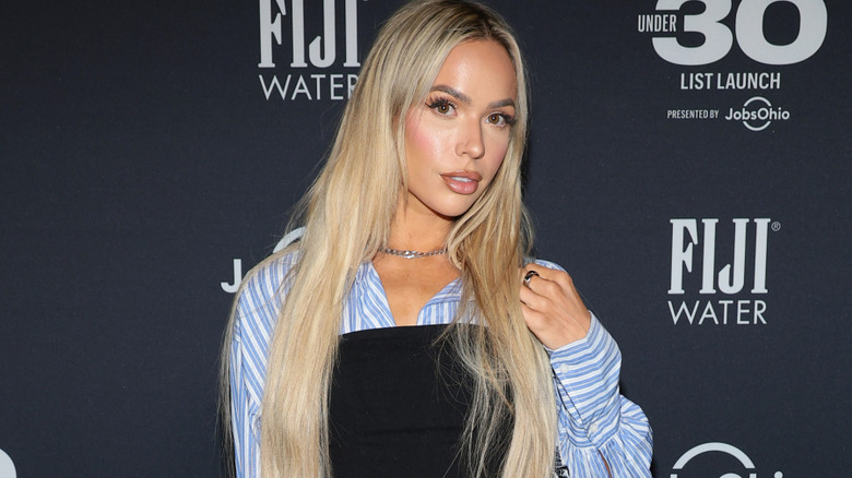 Maxxine Dupri wearing a silver chain necklace