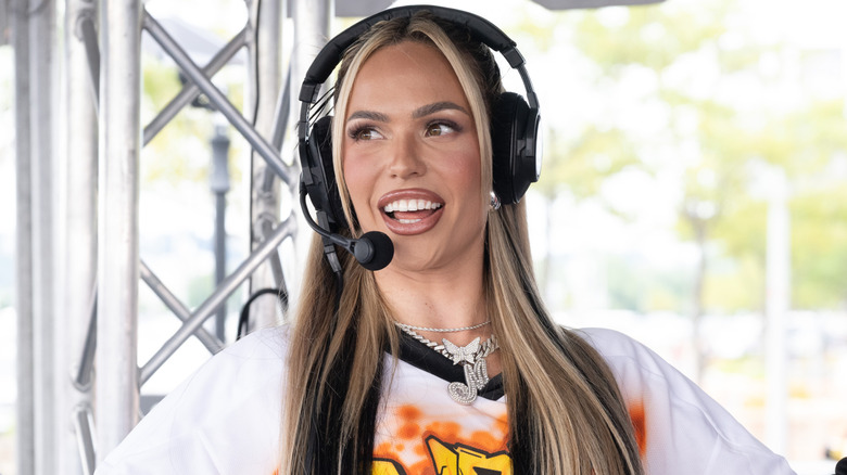 Maxxine Dupri wearing a headset