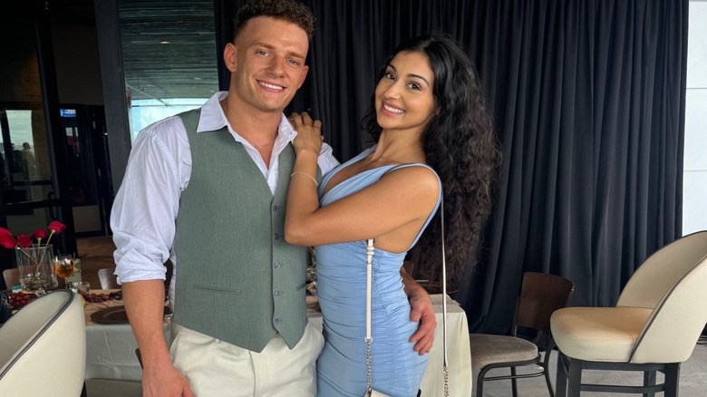 Channing "Stacks" Lorenzo and Arianna Grace pose smiling for a camera at a bar in a photo posted to her X account.