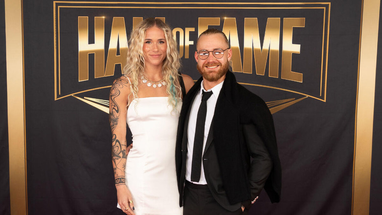 Sol Ruca and Tyler Bate smile for the camera on the red carpet of the 2024 WWE Hall of Fame.