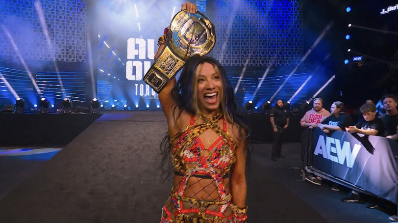 MercedesMone grins wildly as she holds the AEW TBS Championship.