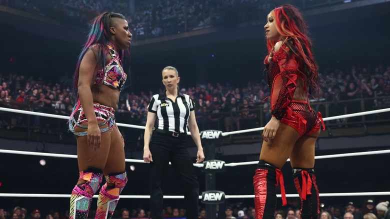 Athena and Mercedes Mone staring at each other