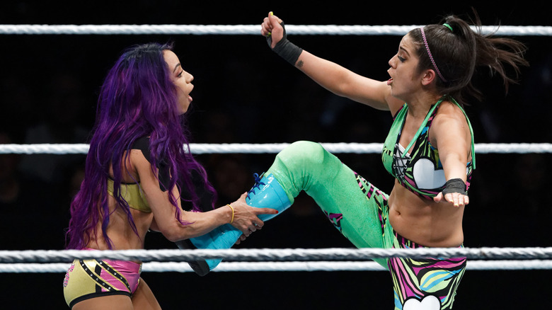 Mercedes Mone counters a kick from Bayley