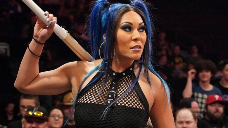 Mia Yim wielding a kendo stick