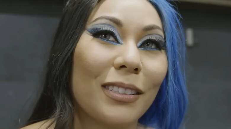 Mia Yim looks away