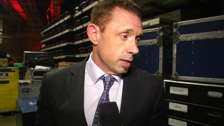 Michael Cole during a backstage interview.