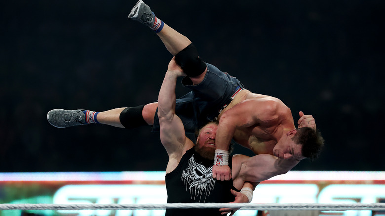 Brock Lesnar delivers an F5 to John Cena