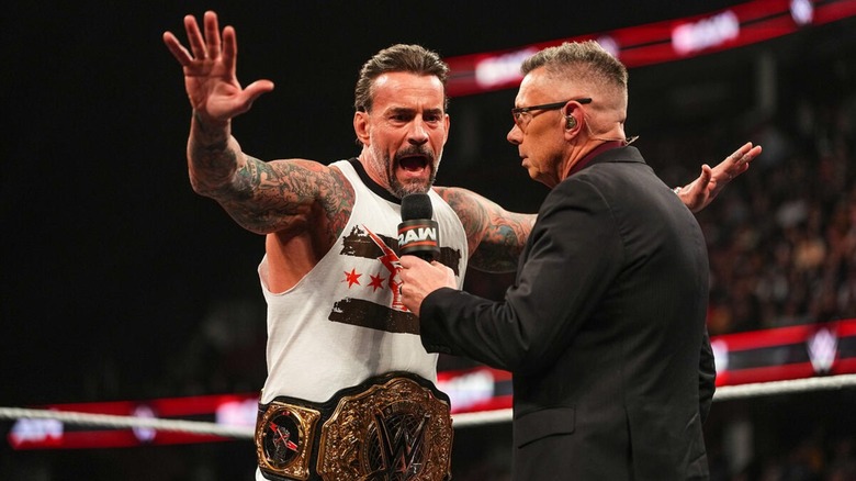 CM Punk and Michael Cole on WWE Raw