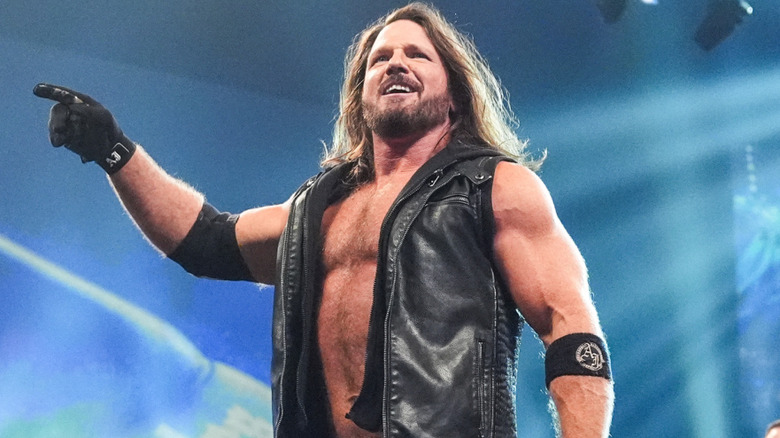 AJ Styles is pointing with his finger