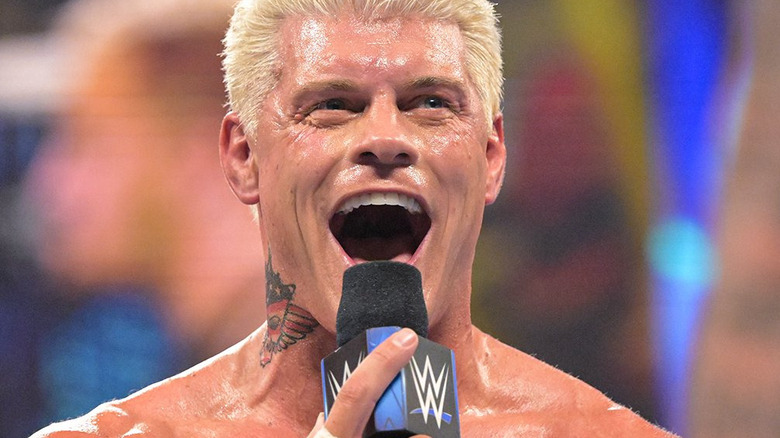 Cody Rhodes eats a mic