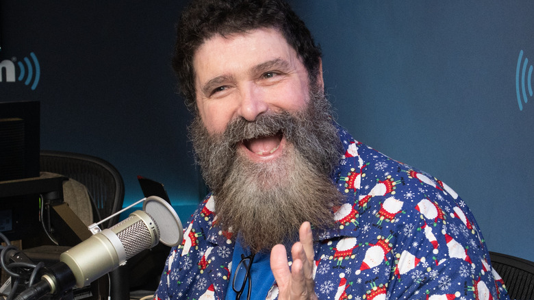 Mick Foley talking into microphone