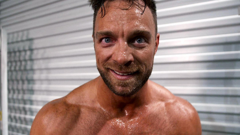 LA Knight smirking