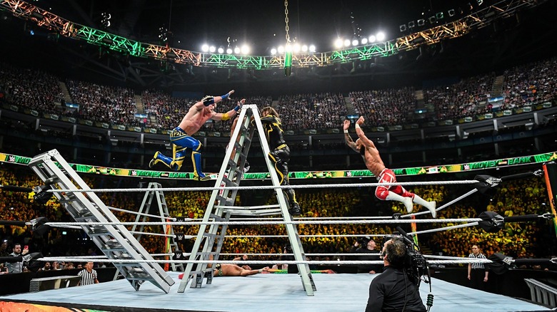 Three WWE Superstars battle to climb a ladder