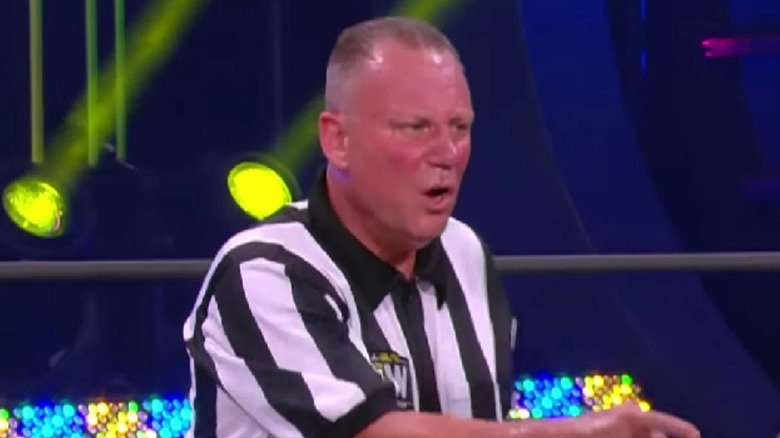 Mike Chioda refereeing during an AEW match