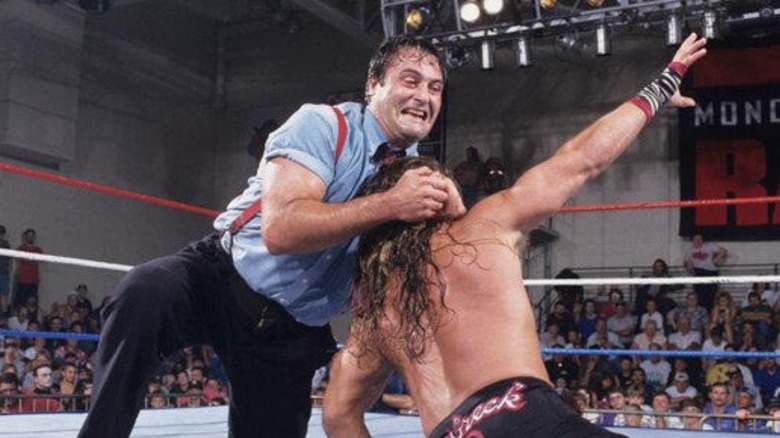 Mike Rotunda, aka IRS, puts a headlock on Shawn Michaels