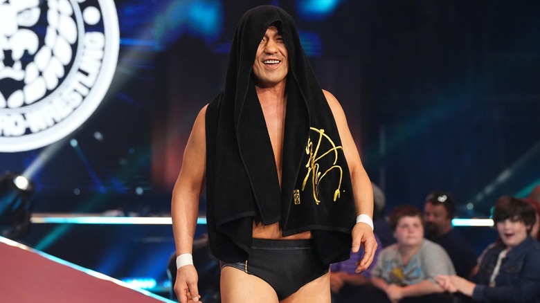 Minoru Suzuki laughs as he makes his entrance