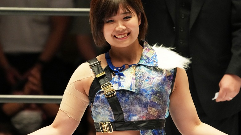 MIRAI smiling and posing during her in-ring introduction