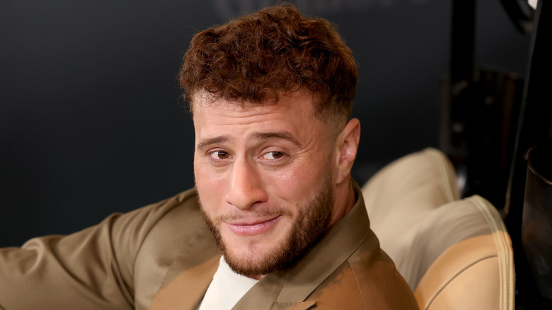 MJF pretending to ride a golf cart