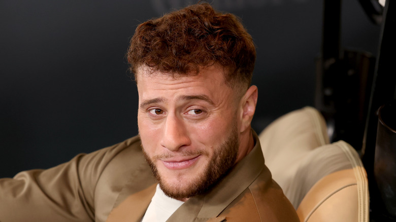 MJF posing for a photo in a golf cart