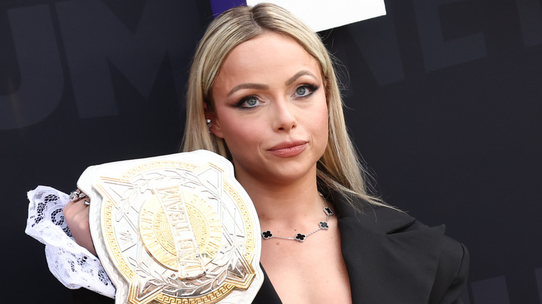 Liv Morgan holding the WWE Women's Tag Team Championship