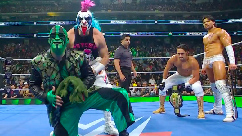 Psycho Clown & Mr. Iguana in the ring with Los Garza