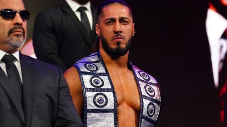 Mustafa Ali looks to the crowd from the stage while making his entrance ahead of a match on 