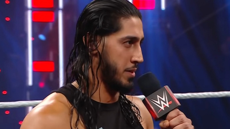 Mustafa Ali talking on the mic