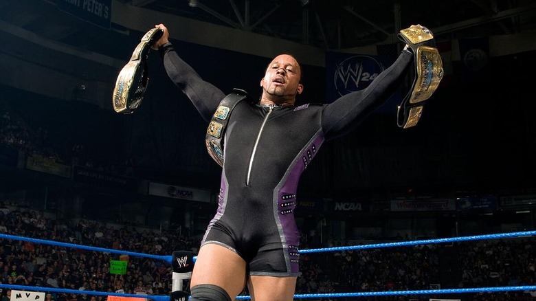 MVP celebrating with the WWE Tag Team Championships and his United States Championship during his first run with WWE,.