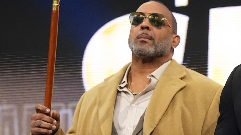 MVP and Shelton Benjamin at the top of the stage ramp staring at Jon Moxley and Josh Alexander during "AEW Dynamite."
