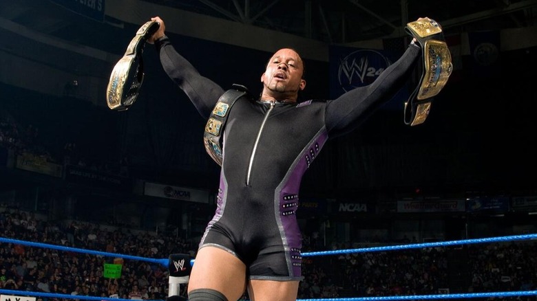 MVP collects a few belts after a triumphant match in the WWE