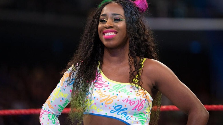 Naomi stands in the ring before a match on WWE TV.