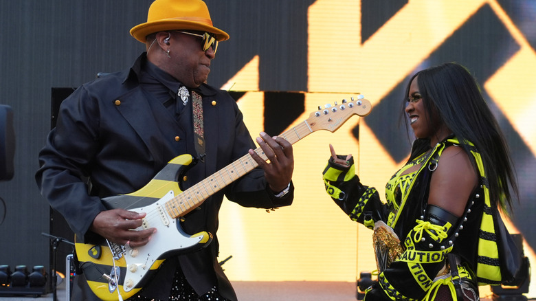 Naomi and her father, Shawn McCray, during her entrance at SummerSlam.