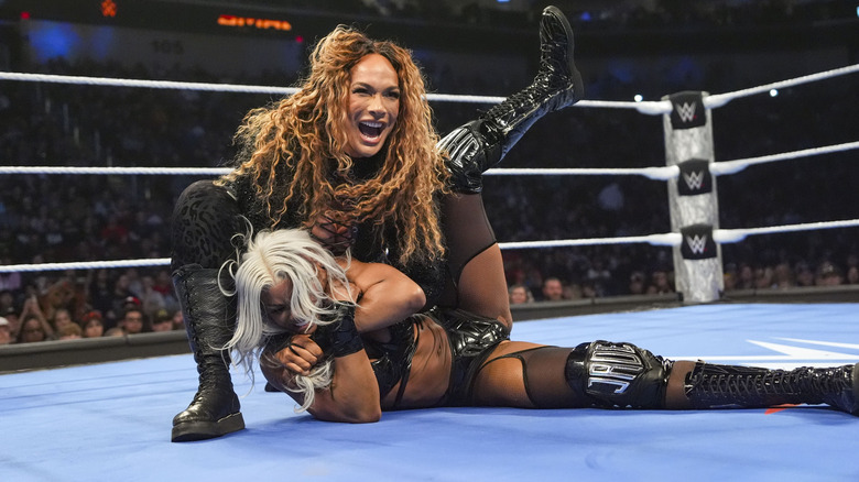 Nia Jax putting Jade Cargill in a half nelson