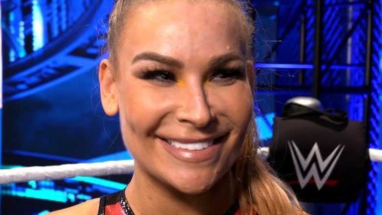 Natalya smiling backstage