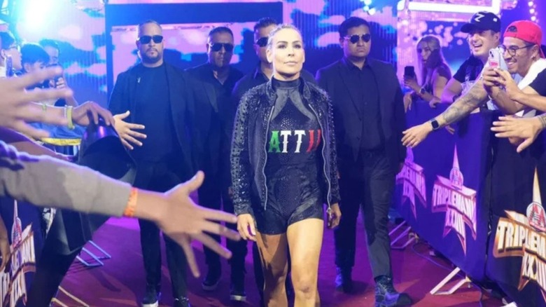 WWE star Natalya, going by her new ring name of Nattie, heads down the ramp to the ring for a match during AAA Worlds Collide.