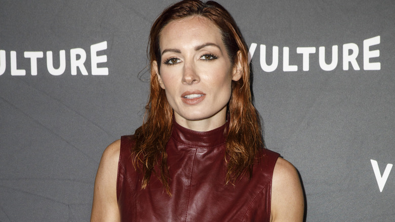 Becky Lynch wearing a maroon leather top