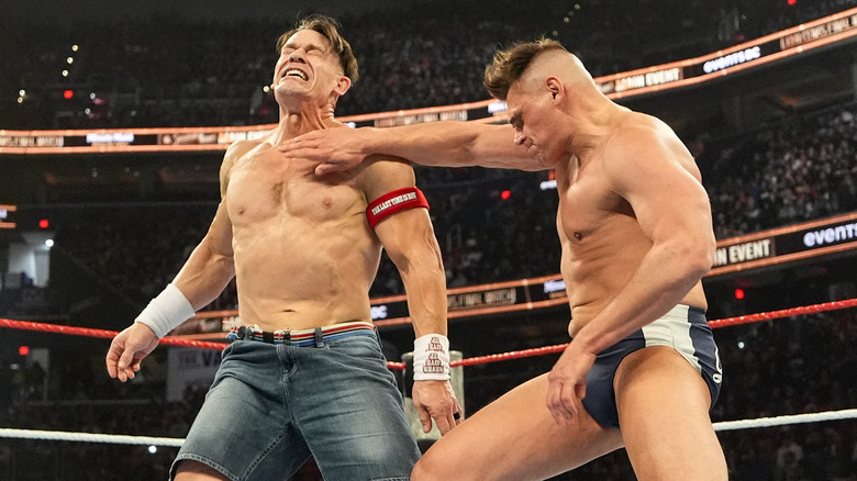 Gunther chopping John Cena in a WWE ring