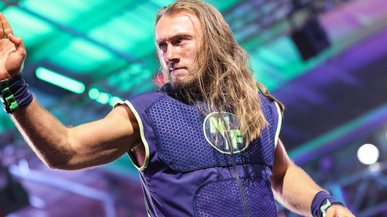 Nathan Frazer is wearing a black vest