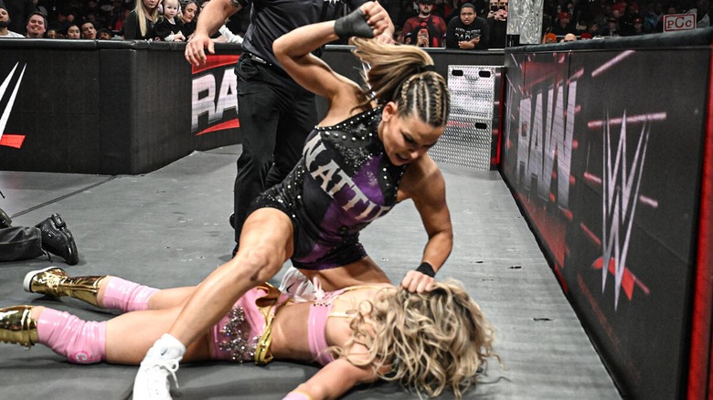 Nattie attacking Maxxine Dupri during their heated rivalry.
