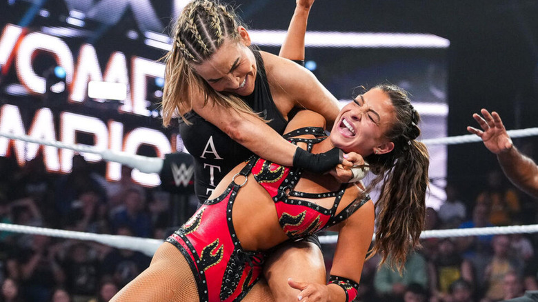 Nattie putting Kendal Grey in a headlock