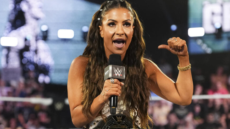 Kendal Grey holding a microphone