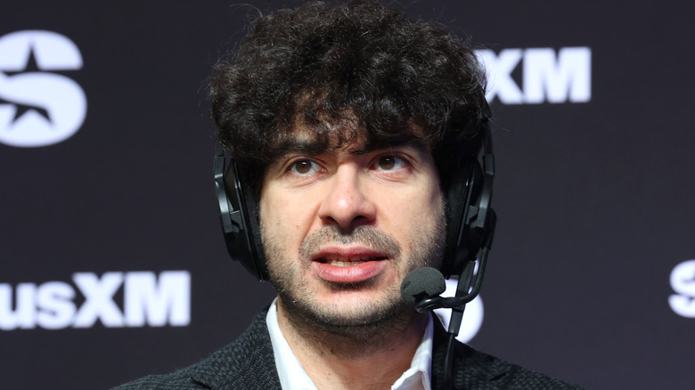 AEW President Tony Khan in a headset