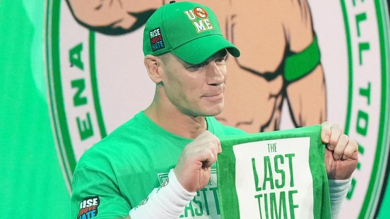 John Cena holding up his flag one last time during the 