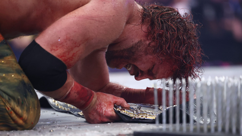 Hangman Adam Page emotional over his AEW World Championship victory in the ring