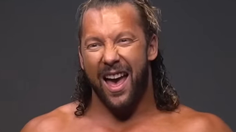 Kenny Omega posing for photos before All Out