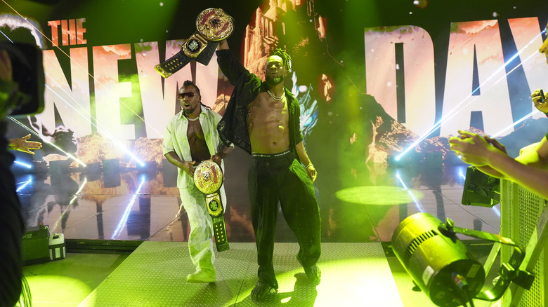 New Day walking to the ring with their tag titles