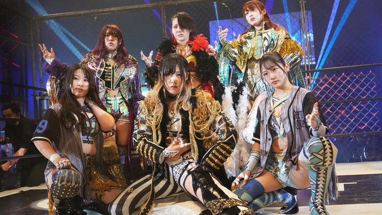 STARDOM wrestlers pose for a photoshoot