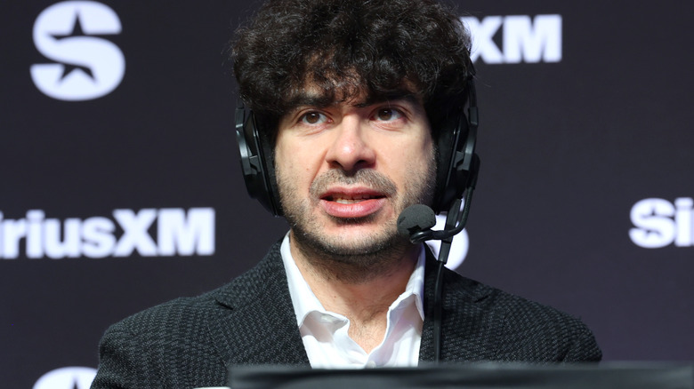 Tony Khan wearing a headset