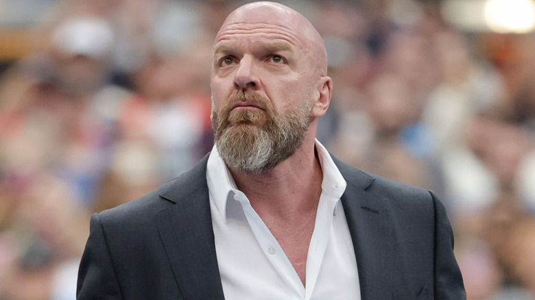 Triple H is wearing a suit